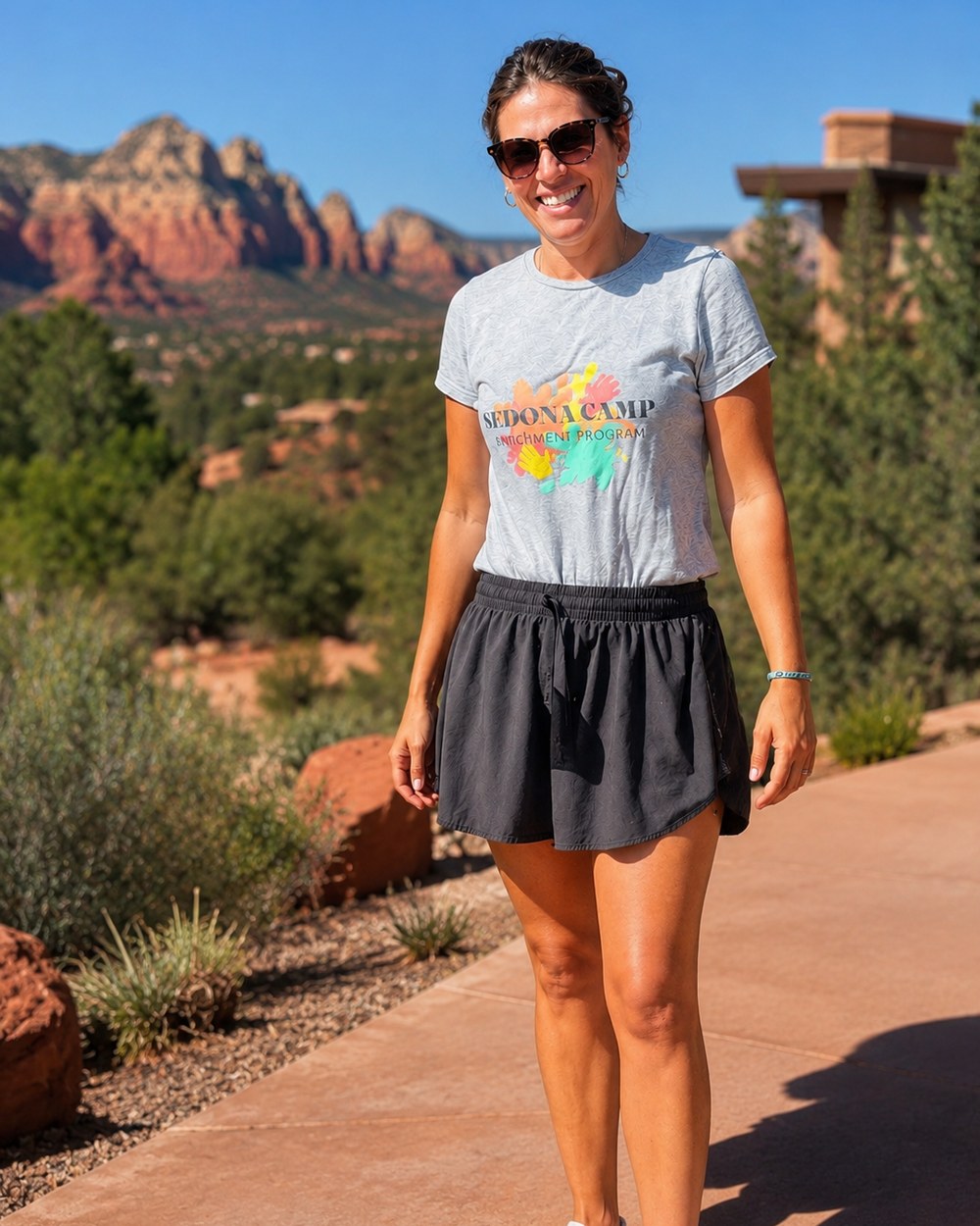 Margot, founder of Sedona Camp, with Sedona's red rocks behind her