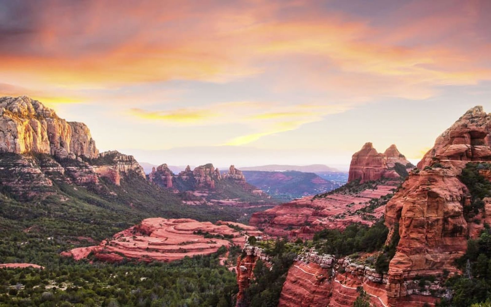 The town of Sedona beneath the red rocks at sunset